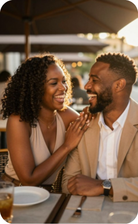 Couple laughing together over dinner